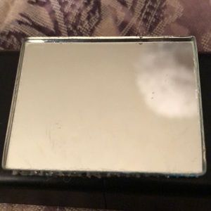 Tiny piece of mirror glass needs minor cleaning